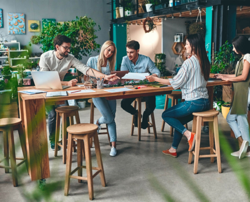 Group of young business people working together in modern office.