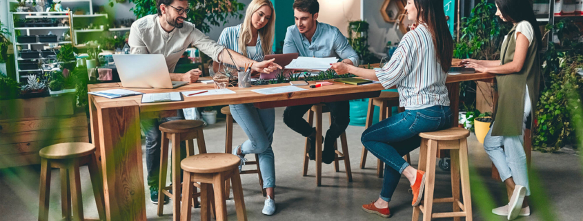 Group of young business people working together in modern office.